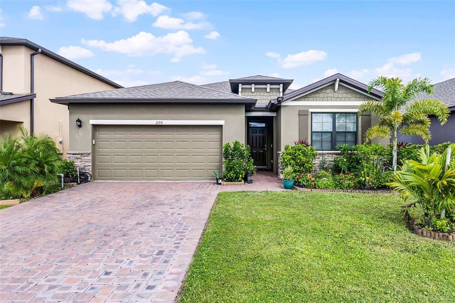 Front exterior of a new home in , Palm Bay, FL, highlighting curb appeal (Image 20).