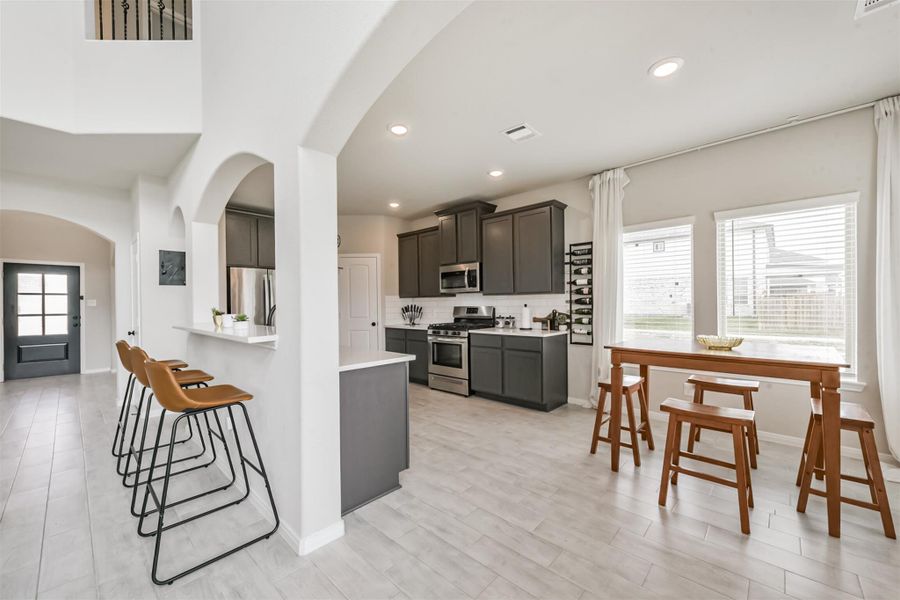The breakfast room flows into the kitchen and provides a more relaxed area for the family to take their time and dine together. The breakfast room flows into the kitchen and provides a more relaxed area for the family to take their time and dine together.