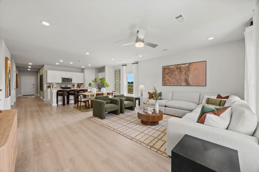 A large living room with a wood floor. A large living room with a wood floor.