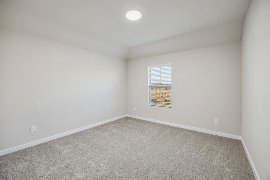 Bedroom in the Wimbledon home plan by Trophy Signature Homes – REPRESENTATIVE PHOTO