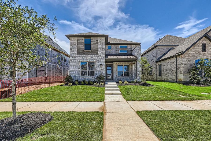 View of front of house with a front yard