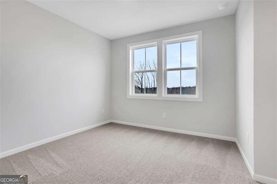 Spacious, unfurnished interior of a new home in The Paddocks at Doc Hughes, Buford (Image 52).