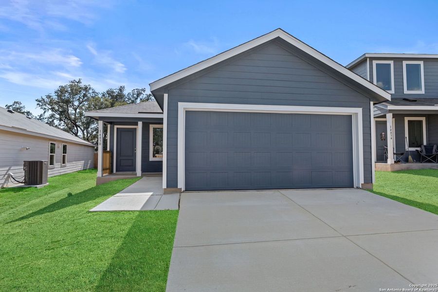 Front exterior of a new home in Waterwheel: Cottage Collection, San Antonio, TX, highlighting curb appeal (Image 1).