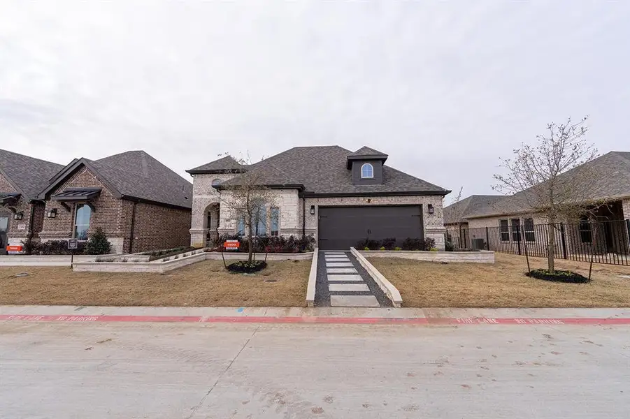 Front exterior of a new home in , Little Elm, TX, highlighting curb appeal (Image 2).