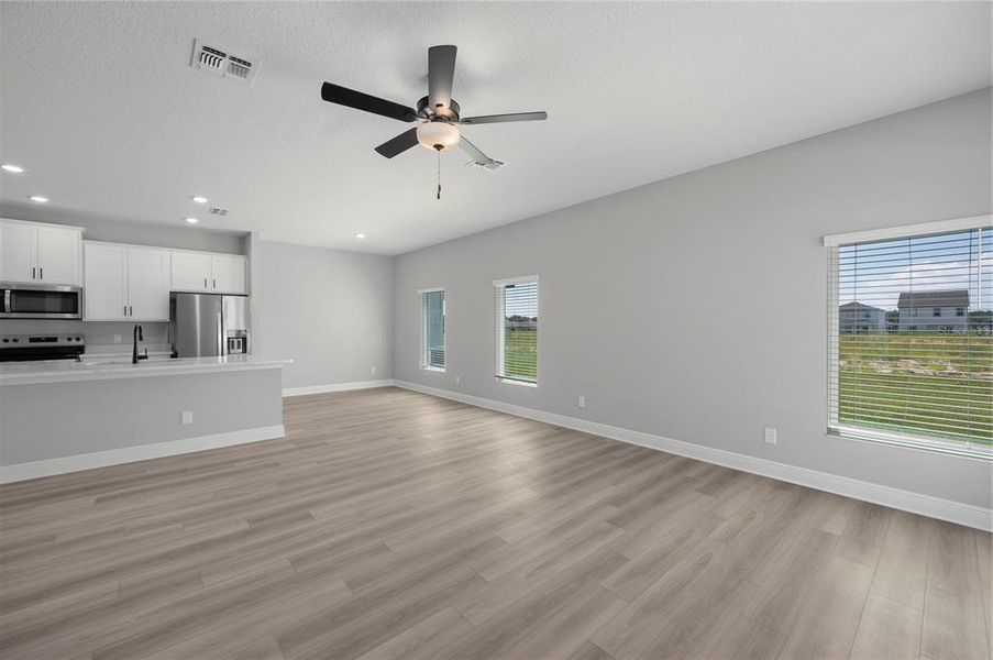 Spacious, unfurnished interior of a new home in Gum Lake Preserve, Lake Alfred (Image 13).