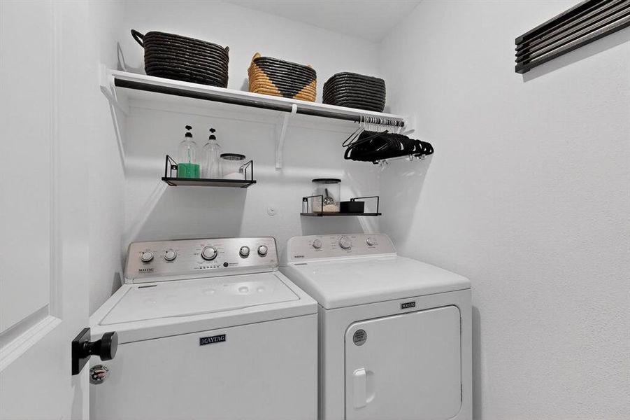 Laundry area featuring washing machine and dryer Laundry area featuring washing machine and dryer