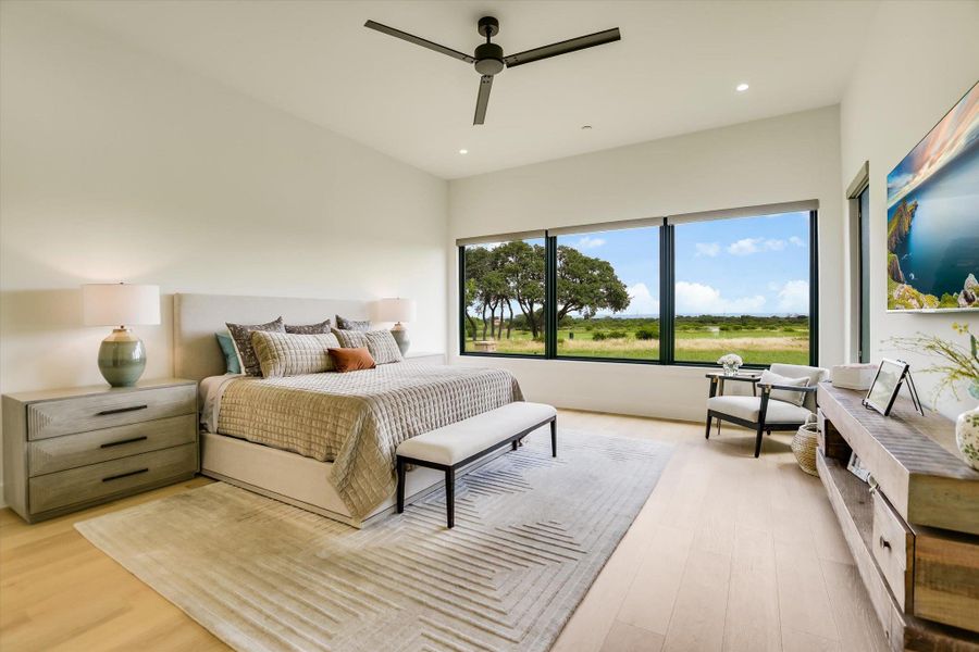 Unwind in this serene bedroom sanctuary with sweeping pastoral views.