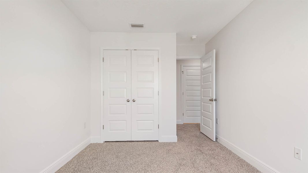 Spacious, unfurnished interior of a new home in Bayside at Ward Creek, Panama City Beach (Image 29).