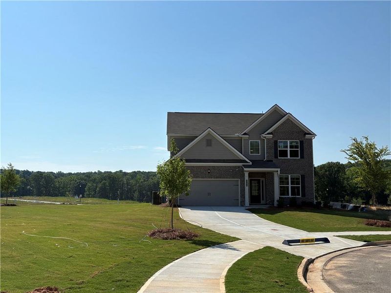 Front exterior of a new home in Highland Park, Stonecrest, GA, highlighting curb appeal (Image 1). Front exterior of a new home in Highland Park, Stonecrest, GA, highlighting curb appeal (Image 1).