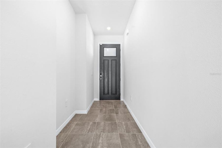 Spacious, unfurnished interior of a new home in The Grove at Stuart Crossing - Premier Series, Bartow (Image 33).