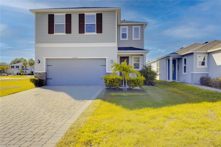 Front exterior of a new home in , Clermont, FL, highlighting curb appeal (Image 21). Front exterior of a new home in , Clermont, FL, highlighting curb appeal (Image 21).