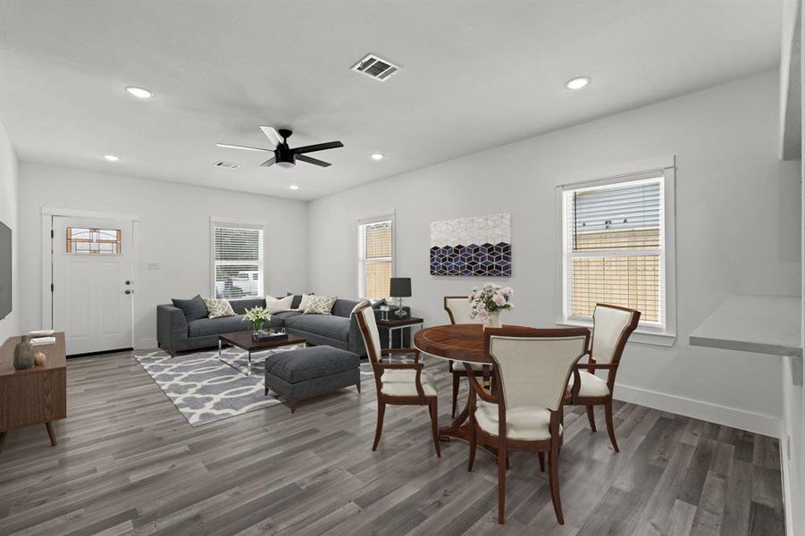 Virtually Staged: Welcome into your gorgeous formal living area and dining area! The beautiful vinyl floors are carried throughout the whole home.