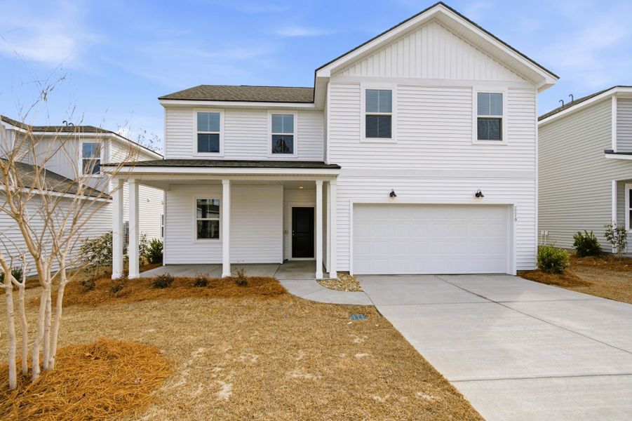 Front exterior of a new home in Grand Arbor, Blythewood, SC, highlighting curb appeal (Image 17).