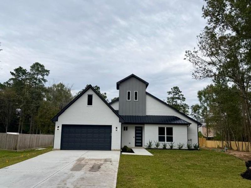 Front exterior of a new home in , Magnolia, TX, highlighting curb appeal (Image 21). Front exterior of a new home in , Magnolia, TX, highlighting curb appeal (Image 21).