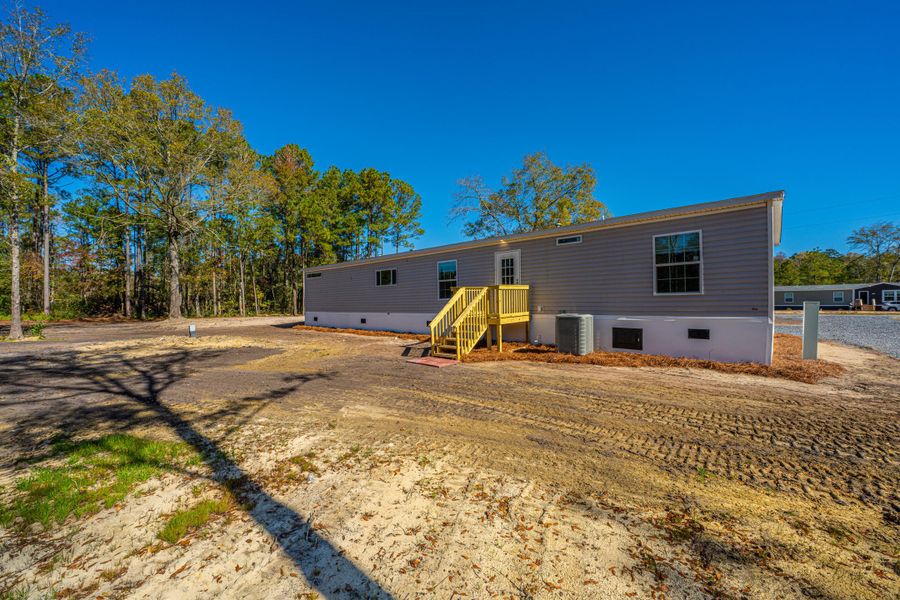 Exterior details and patio area of a home in , Pinopolis (Image 2).