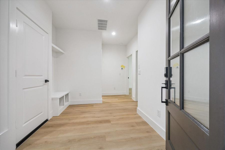 Functional first-floor arrival space with natural light and storage