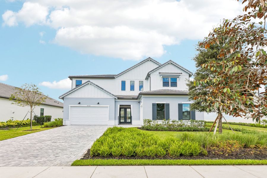 Front exterior of a new home in Marigold, Davie, FL, highlighting curb appeal (Image 23). Front exterior of a new home in Marigold, Davie, FL, highlighting curb appeal (Image 23).