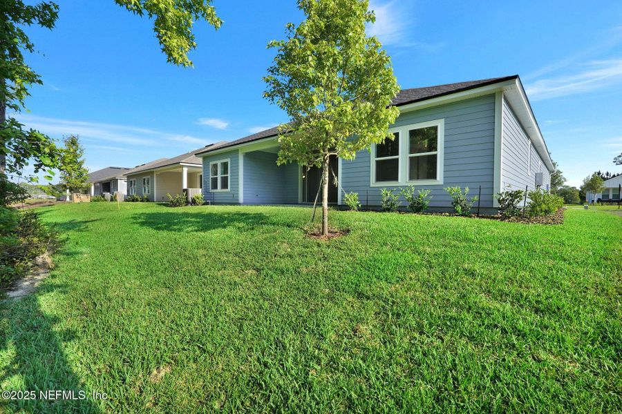 Front exterior of a new home in Trailmark - Phase 10, St. Augustine, FL, highlighting curb appeal (Image 20).