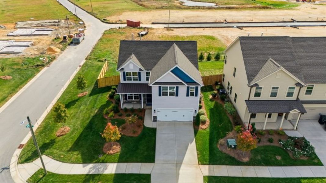 Front exterior of a new home in Miller's Reserve, Greensboro, NC, highlighting curb appeal (Image 24). Front exterior of a new home in Miller's Reserve, Greensboro, NC, highlighting curb appeal (Image 24).