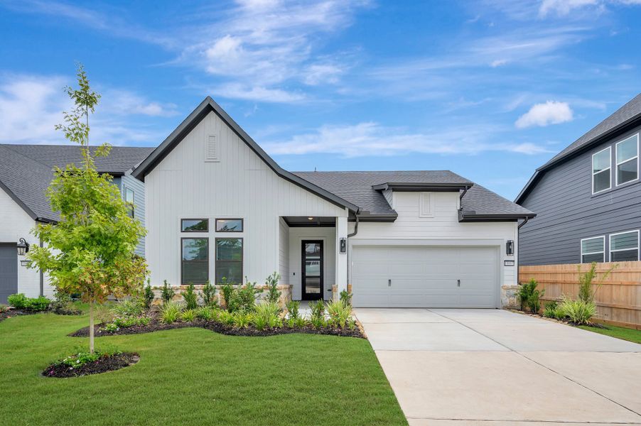 Front exterior of a new home in ARTAVIA - Enclave Collection, Conroe, TX, highlighting curb appeal (Image 27).