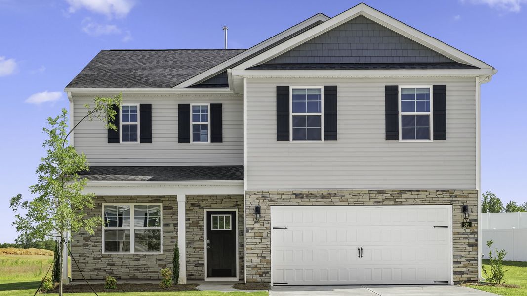 Front exterior of a new home in Colly Farm, Stokesdale, NC, highlighting curb appeal (Image 1). Front exterior of a new home in Colly Farm, Stokesdale, NC, highlighting curb appeal (Image 1).