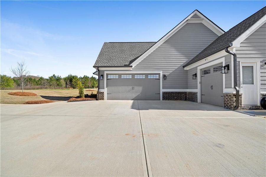 Front exterior of a new home in , Monroe, GA, highlighting curb appeal (Image 26).