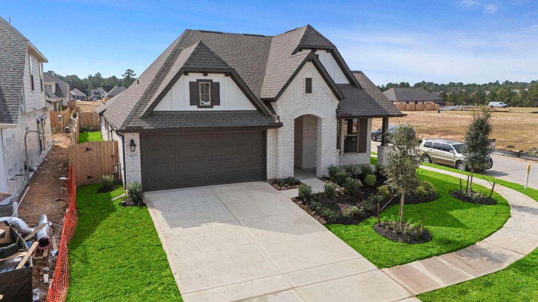 Front exterior of a new home in Escondido, Magnolia, TX, highlighting curb appeal (Image 21). Front exterior of a new home in Escondido, Magnolia, TX, highlighting curb appeal (Image 21).