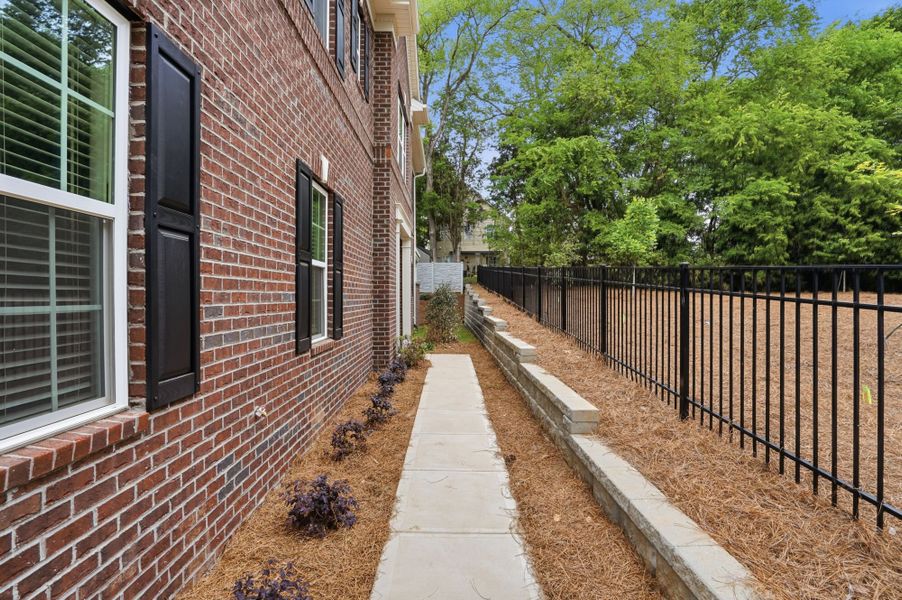 Exterior details and patio area of a home in The Townes at Wade Ardrey, Charlotte (Image 3). Exterior details and patio area of a home in The Townes at Wade Ardrey, Charlotte (Image 3).