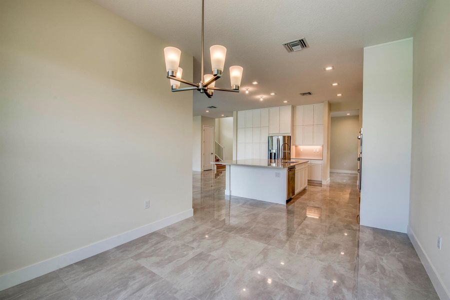 Furnished interior view inside a new home in Apex at Avenir, Palm Beach Gardens (Image 25).