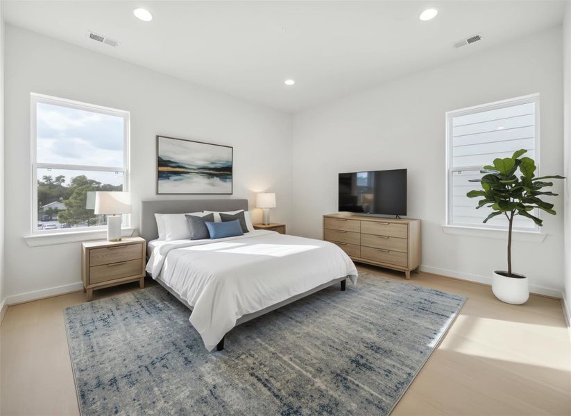 Secondary bedroom adjacent to the third-floor game room, featuring abundant natural light and a versatile layout, perfect for guests, a home office, or a private retreat. *Virtually staged*