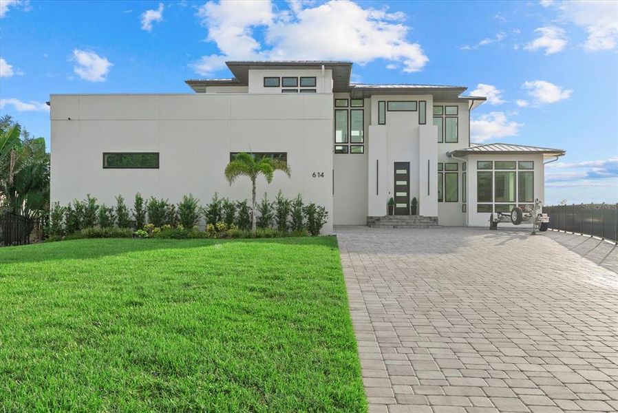 Front exterior of a new home in , Osprey, FL, highlighting curb appeal (Image 26).