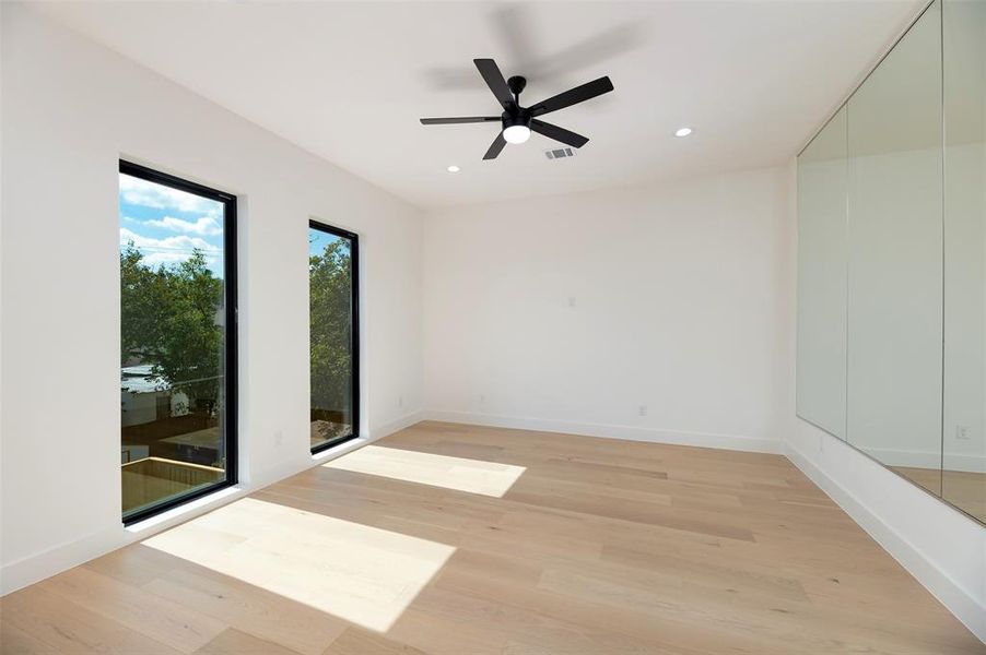 Unfurnished room with light wood finished floors, recessed lighting, and ceiling fan Unfurnished room with light wood finished floors, recessed lighting, and ceiling fan