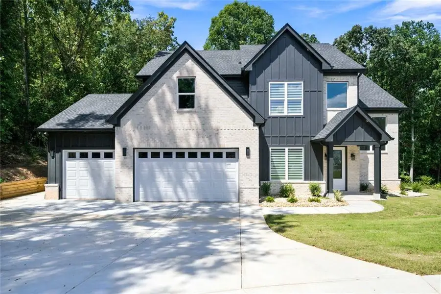 Front exterior of a new home in , Monroe, GA, highlighting curb appeal (Image 26). Front exterior of a new home in , Monroe, GA, highlighting curb appeal (Image 26).