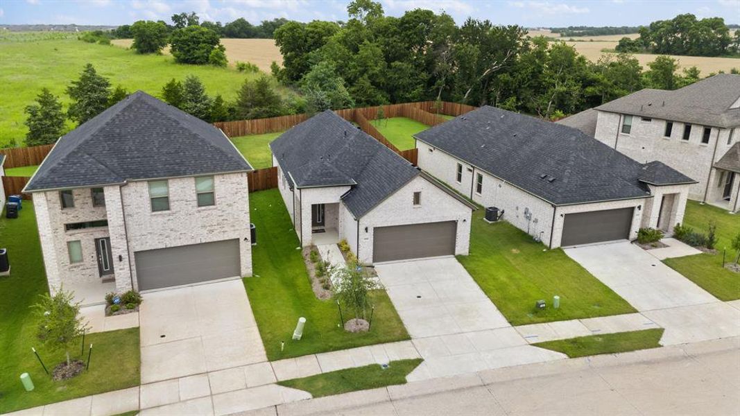 Front exterior of a new home in , Princeton, TX, highlighting curb appeal (Image 20).