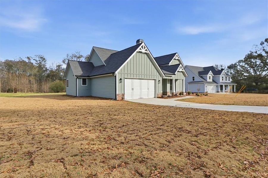Front exterior of a new home in , Statham, GA, highlighting curb appeal (Image 30).
