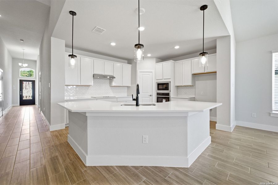 Furnished interior view inside a new home in The Woodlands at Medina Hills, Mico (Image 9).
