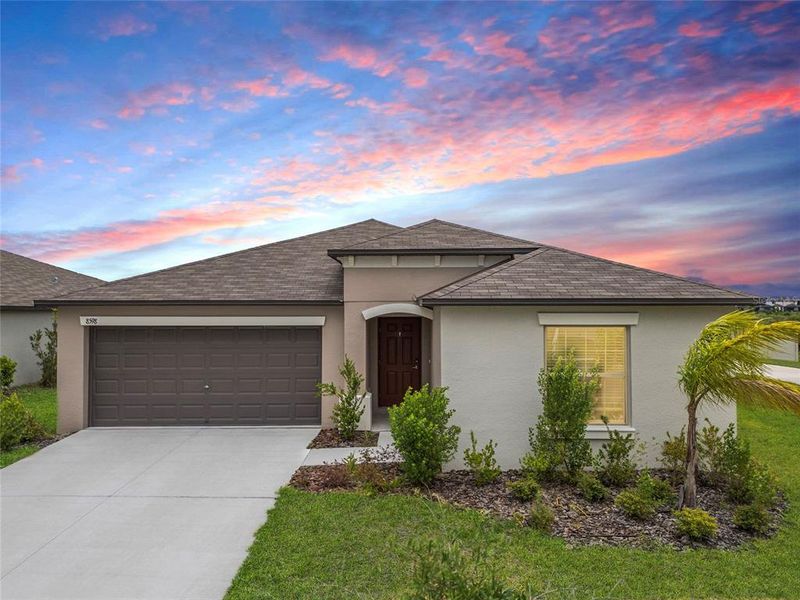 Front exterior of a new home in , Wesley Chapel, FL, highlighting curb appeal (Image 1).