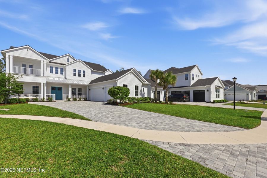 Front exterior of a new home in , Ponte Vedra, FL, highlighting curb appeal (Image 26).