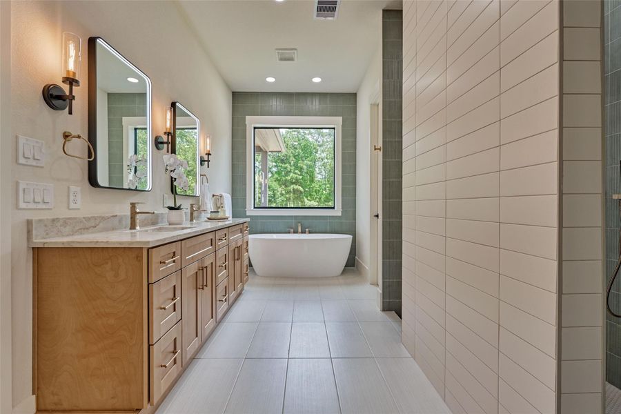 Your own private spa awaits — smart fogless mirrors, a sunlit dual vanity, a soothing sage-green shower with dual shower heads, and a soaker tub framed by floor-to-ceiling windows. This is where your morning routine becomes a ritual. Your own private spa awaits — smart fogless mirrors, a sunlit dual vanity, a soothing sage-green shower with dual shower heads, and a soaker tub framed by floor-to-ceiling windows. This is where your morning routine becomes a ritual.