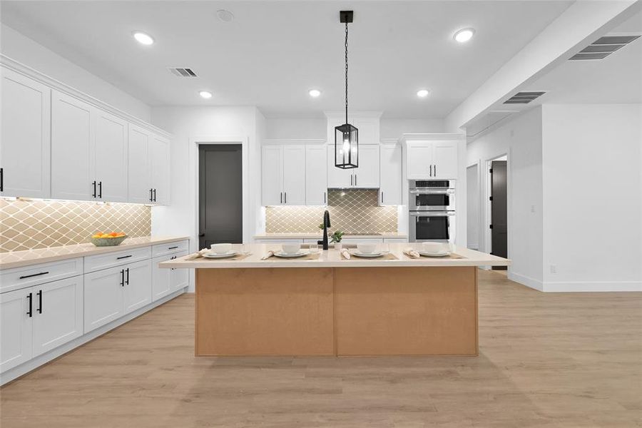 Chef's kitchen with plenty of storage space and a walk in pantry