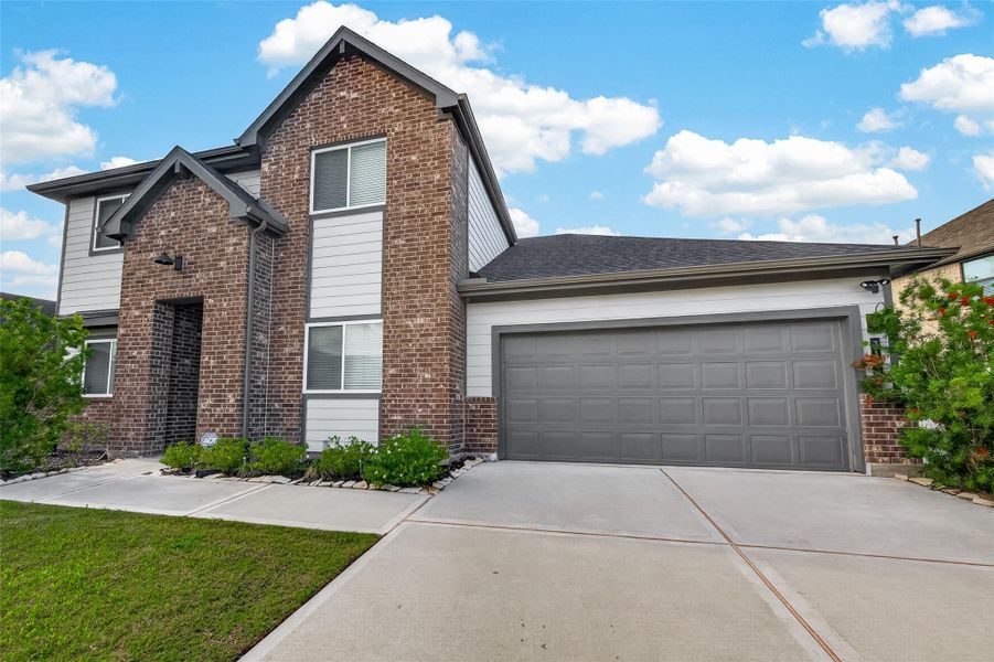 Front exterior of a new home in Westland Ranch 50' Homesites, League City, TX, highlighting curb appeal (Image 21).