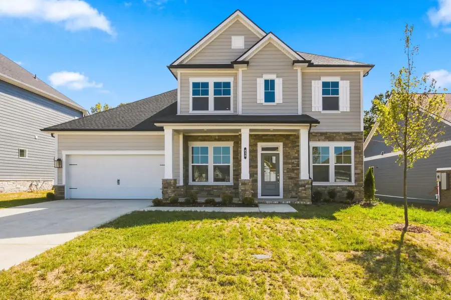 Front exterior of a new home in Heritage Green – The Signature Collection, Columbia, TN, highlighting curb appeal (Image 1). Front exterior of a new home in Heritage Green – The Signature Collection, Columbia, TN, highlighting curb appeal (Image 1).
