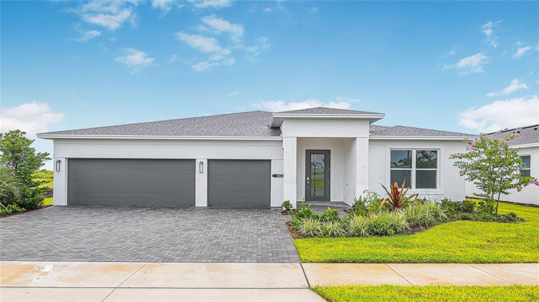 Front exterior of a new home in Cresswind at Lake Harris, Tavares, FL, highlighting curb appeal (Image 28).