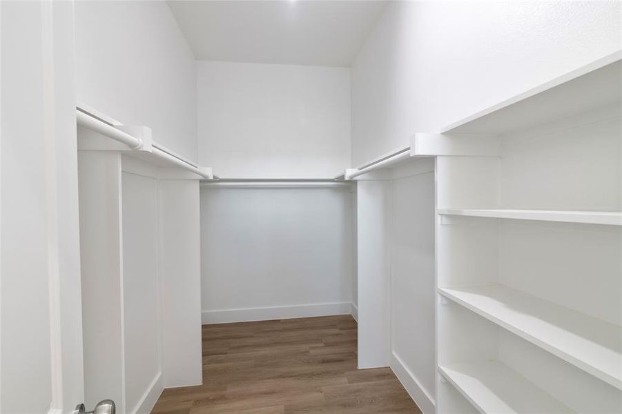 Walk in closet featuring hardwood / wood-style floors