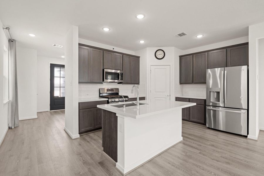 Your family and guests will enjoy many nights of fun, food and entertainment with ample counter space and kitchen island for setting up a wonderful array of provisions!