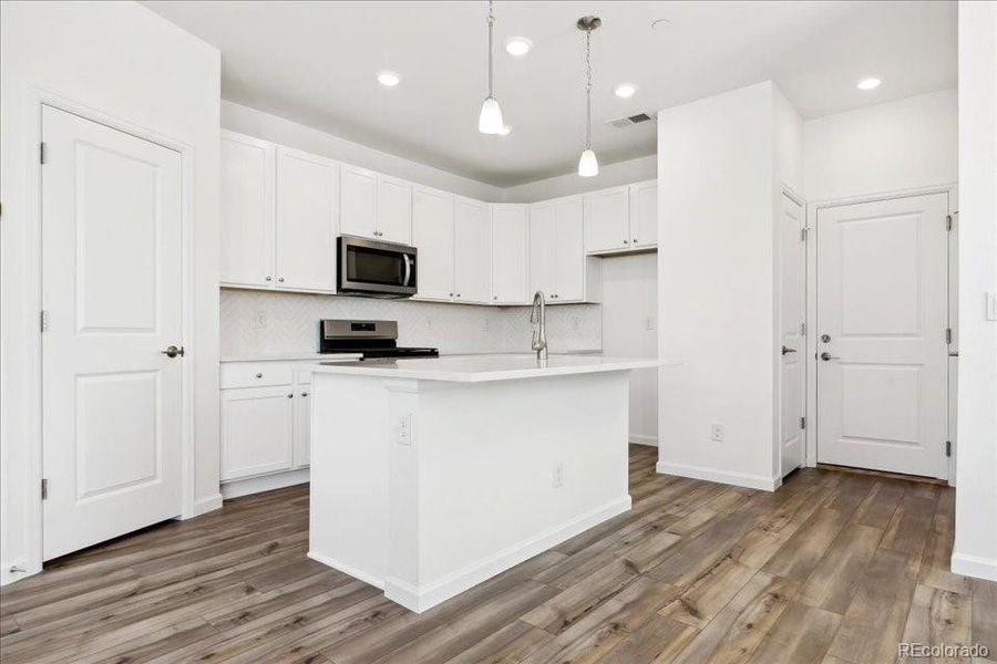 Furnished interior view inside a new home in Pacific Collection at The Townes at Skyline Ridge, Castle Pines (Image 4).