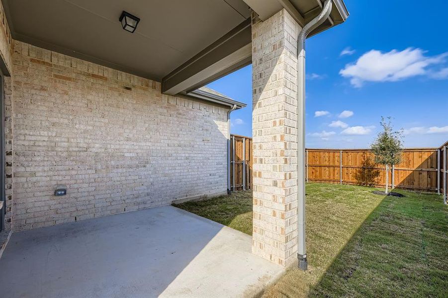 Fenced backyard featuring a patio Fenced backyard featuring a patio