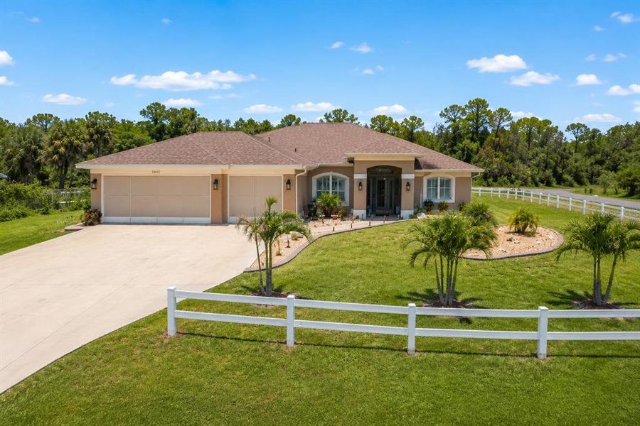Front exterior of a new home in , North Port, FL, highlighting curb appeal (Image 21). Front exterior of a new home in , North Port, FL, highlighting curb appeal (Image 21).