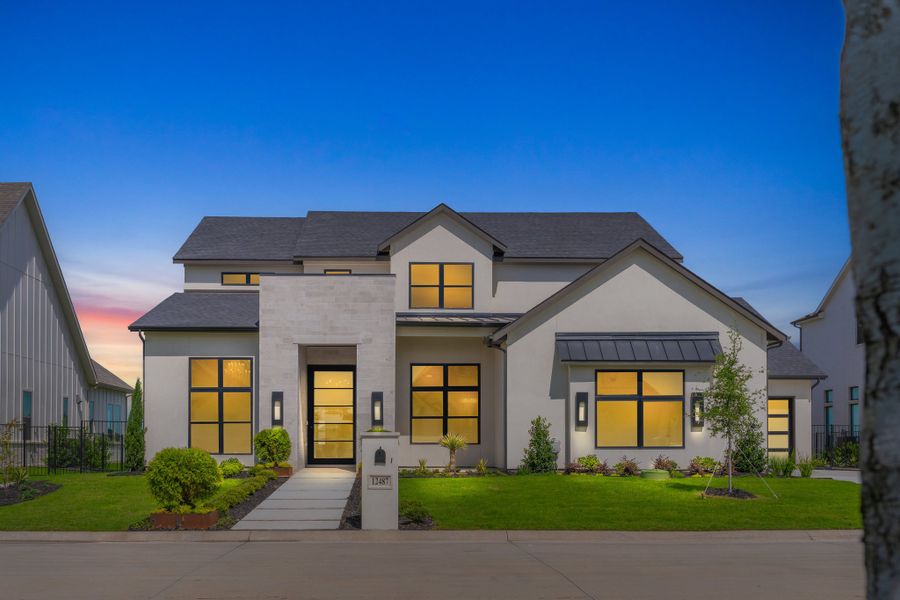 Front exterior of a new home in The Resort on Eagle Mt. Lake, Fort Worth, TX, highlighting curb appeal (Image 28). Front exterior of a new home in The Resort on Eagle Mt. Lake, Fort Worth, TX, highlighting curb appeal (Image 28).