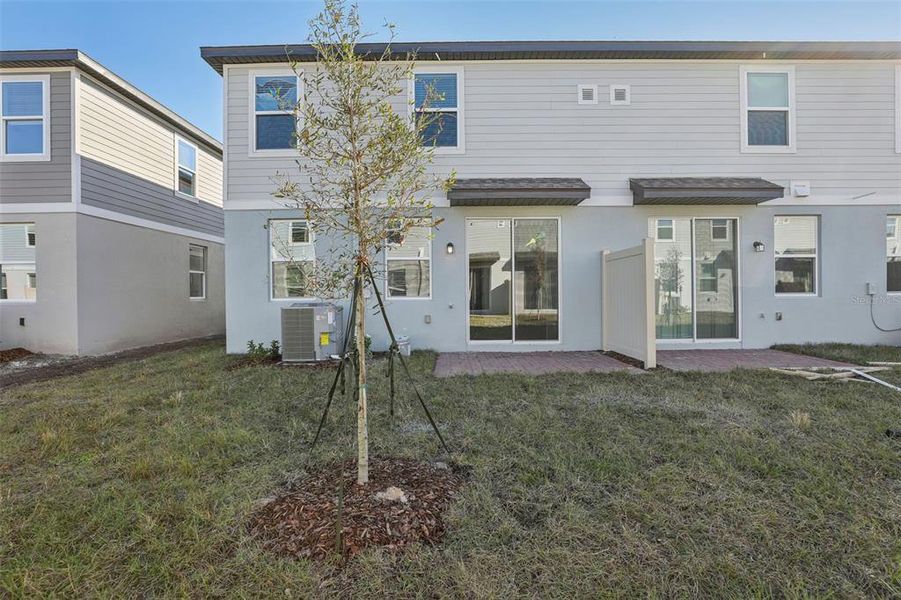 Exterior details and patio area of a home in The Meadow at Crossprairie Townes, St. Cloud (Image 2). Exterior details and patio area of a home in The Meadow at Crossprairie Townes, St. Cloud (Image 2).